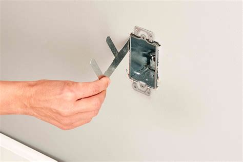 electrical box installation metal strips|cutting in electrical box installation.